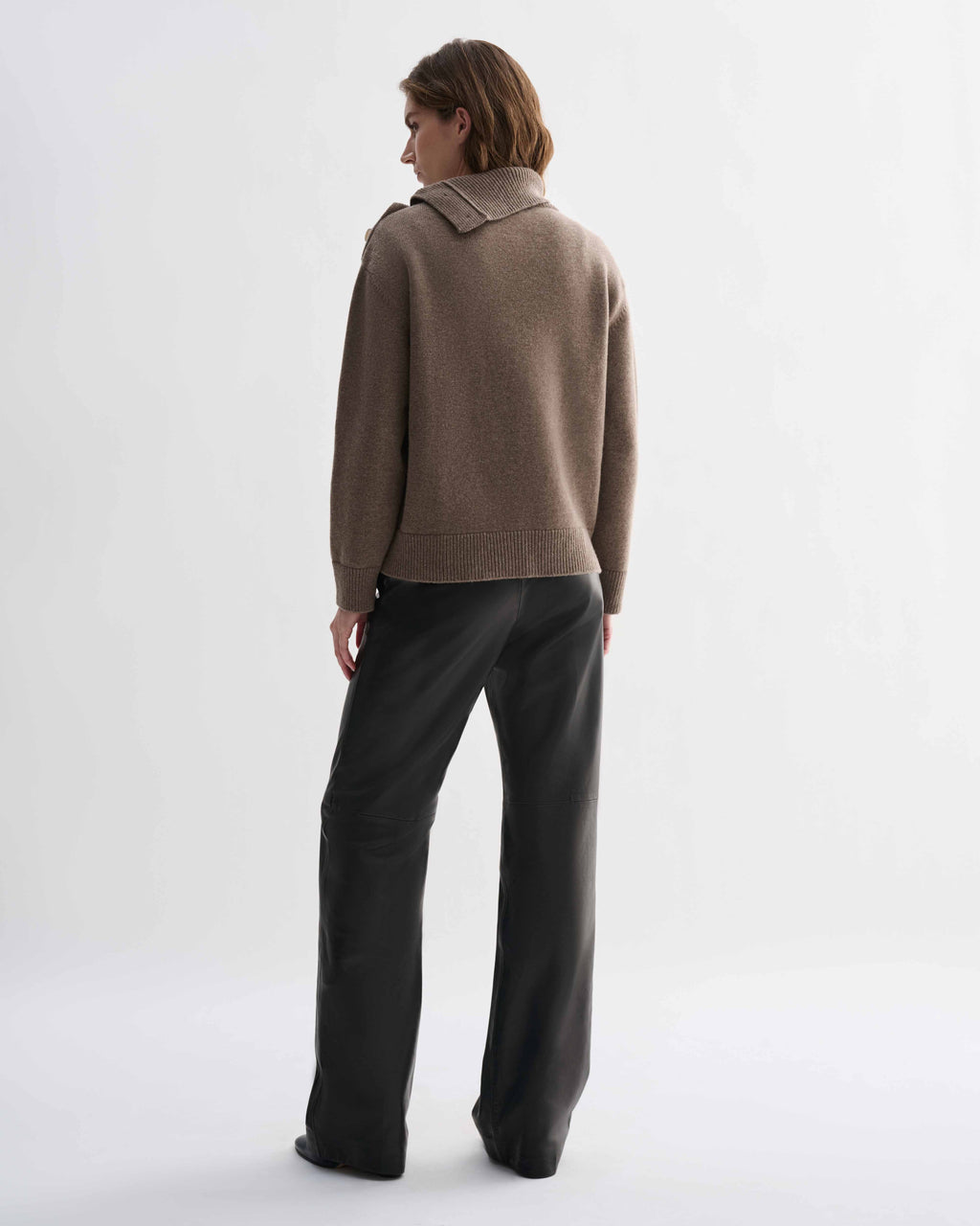 Cielo Wool Cashmere camel chunky knit sweater, relaxed fit, on model. Features side buttoning with horn buttons, adjustable neckline