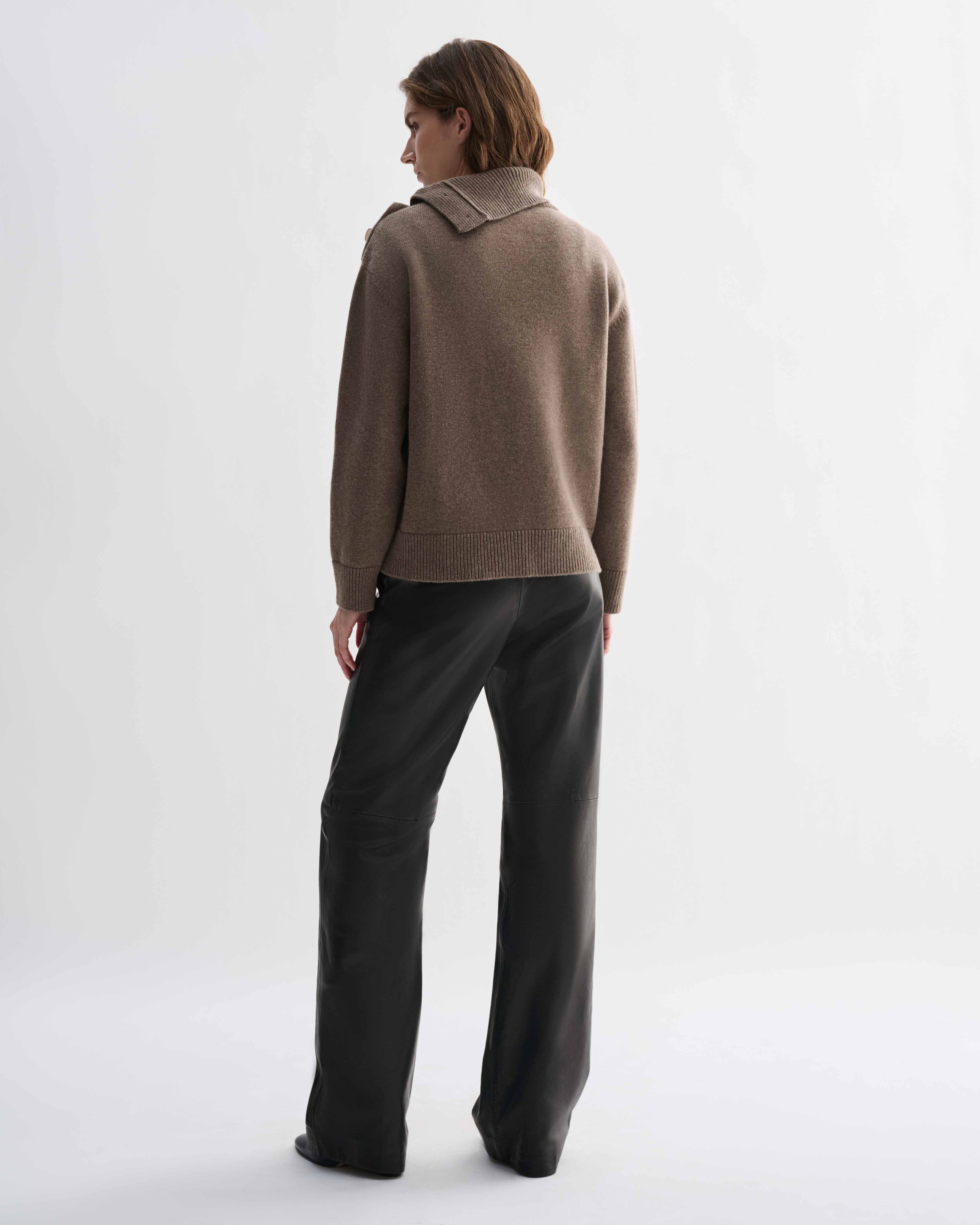Cielo Wool Cashmere camel chunky knit sweater, relaxed fit, on model. Features side buttoning with horn buttons, adjustable neckline