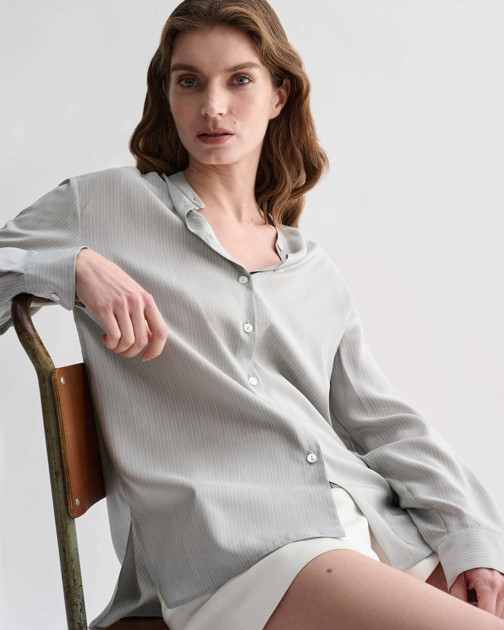 Grey pinstripe silk Daisy shirt by Veronica De Piante, featuring a stylish and elegant top with a classic pattern.