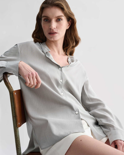 Daisy Shirt in Silk, Grey Pinstripe Model wears luxury top with stand collar and classic cuffed sleeves