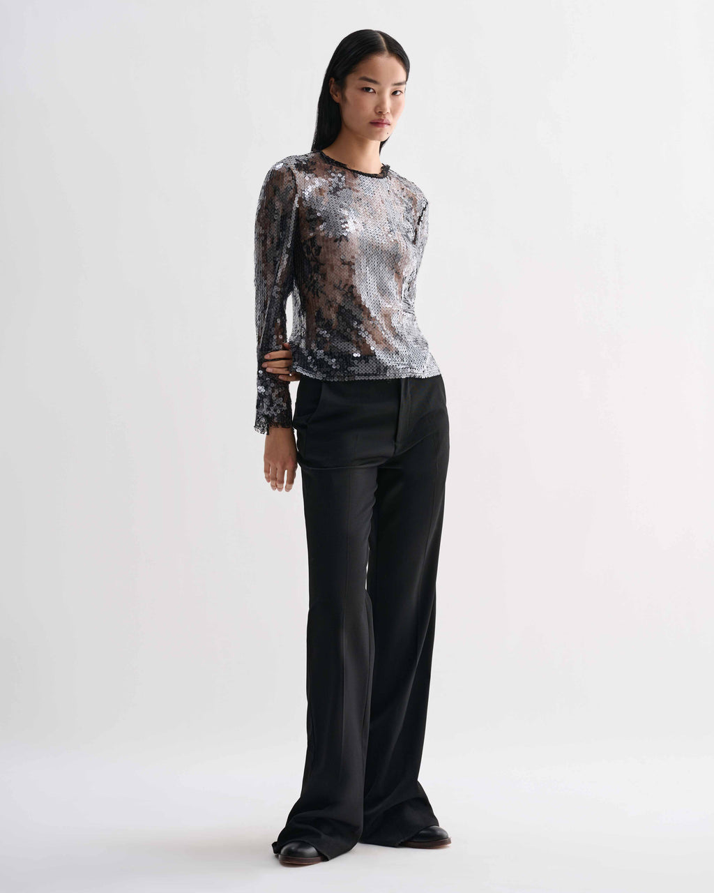 Black Dalia Top in lace sequins, long sleeve, crewneck. Shimmering, sheer luxury evening top featuring intricate lace