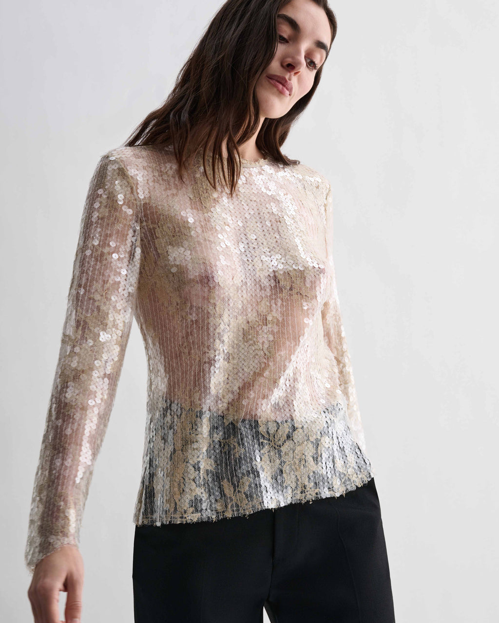 Gold Dalia Top: women's shimmering sheer lace sequin long-sleeve top, rich texture on model