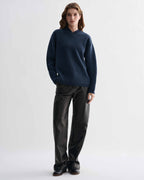 Elara blue cashmere V-neck sweater, relaxed fit with eased shoulders, elevated dense knitwear on model