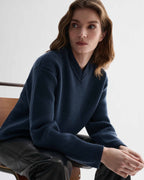 Elara blue cashmere V-neck sweater. Relaxed fit knit with straight body, eased shoulder. Compact, dense, elevated knitwear