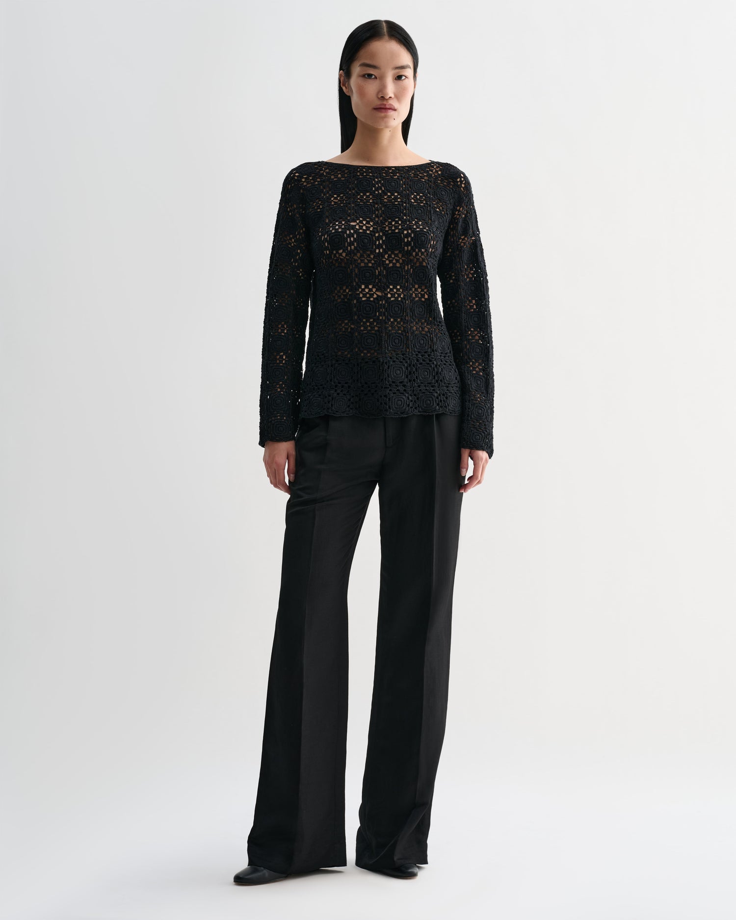 Black silk crochet Elodie top by Veronica De Piante, featuring intricate knitwear design and stylish neckline.