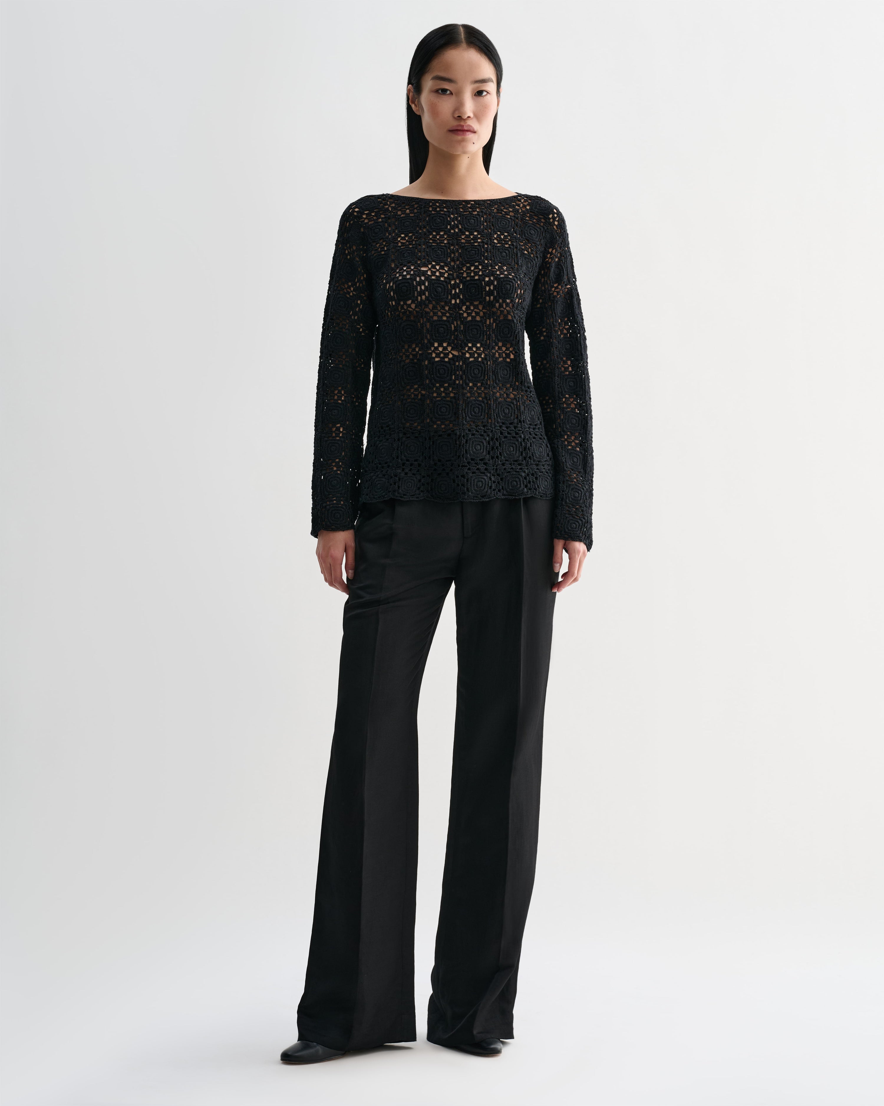 Black silk crochet Elodie top by Veronica De Piante, featuring intricate knitwear design and stylish neckline.