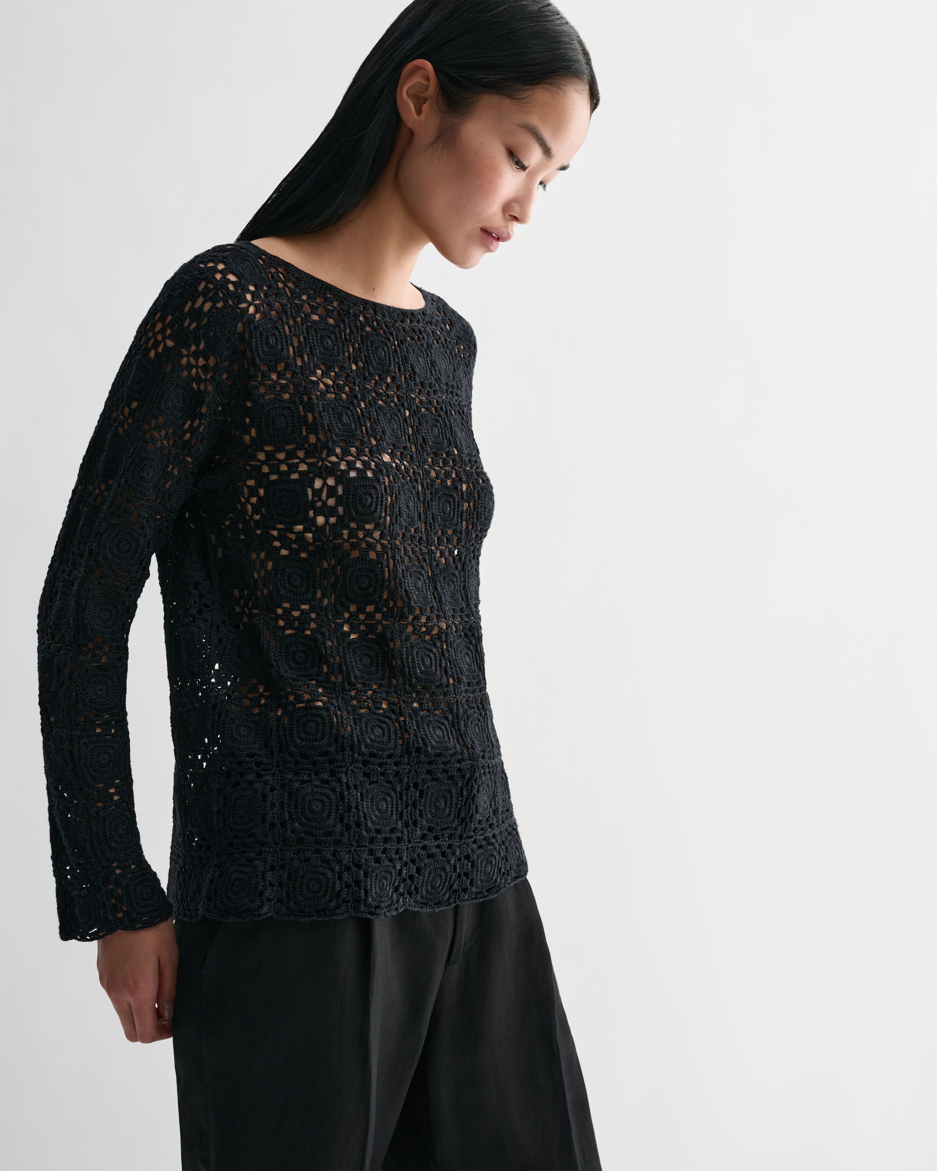 Black Veronica De Piante Elodie Silk Crochet Top, showcasing intricate knitwear design and fine craftsmanship.