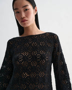 Black silk crochet Elodie top by Veronica De Piante, showcasing intricate knitwear with detailed crochet pattern.