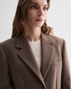 Freya Coat in oatmeal pure cashmere on model. Luxury Italian women's overcoat with broad shoulders and slouchy fit