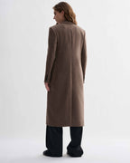 Freya oatmeal wool cashmere long overcoat, women's, modeled from back. Roomy fit, broad shoulders. Italian luxury