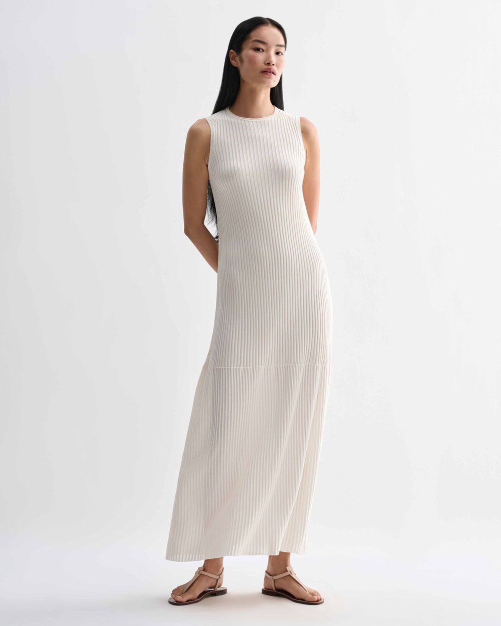 Off-white Gabby dress by Veronica De Piante, made of viscose fabric, shown on a hanger with flowing, elegant design.