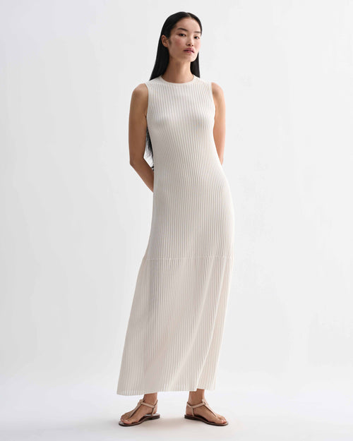 Off-white Gabby dress by Veronica De Piante, made of viscose fabric, shown on a hanger with flowing, elegant design.