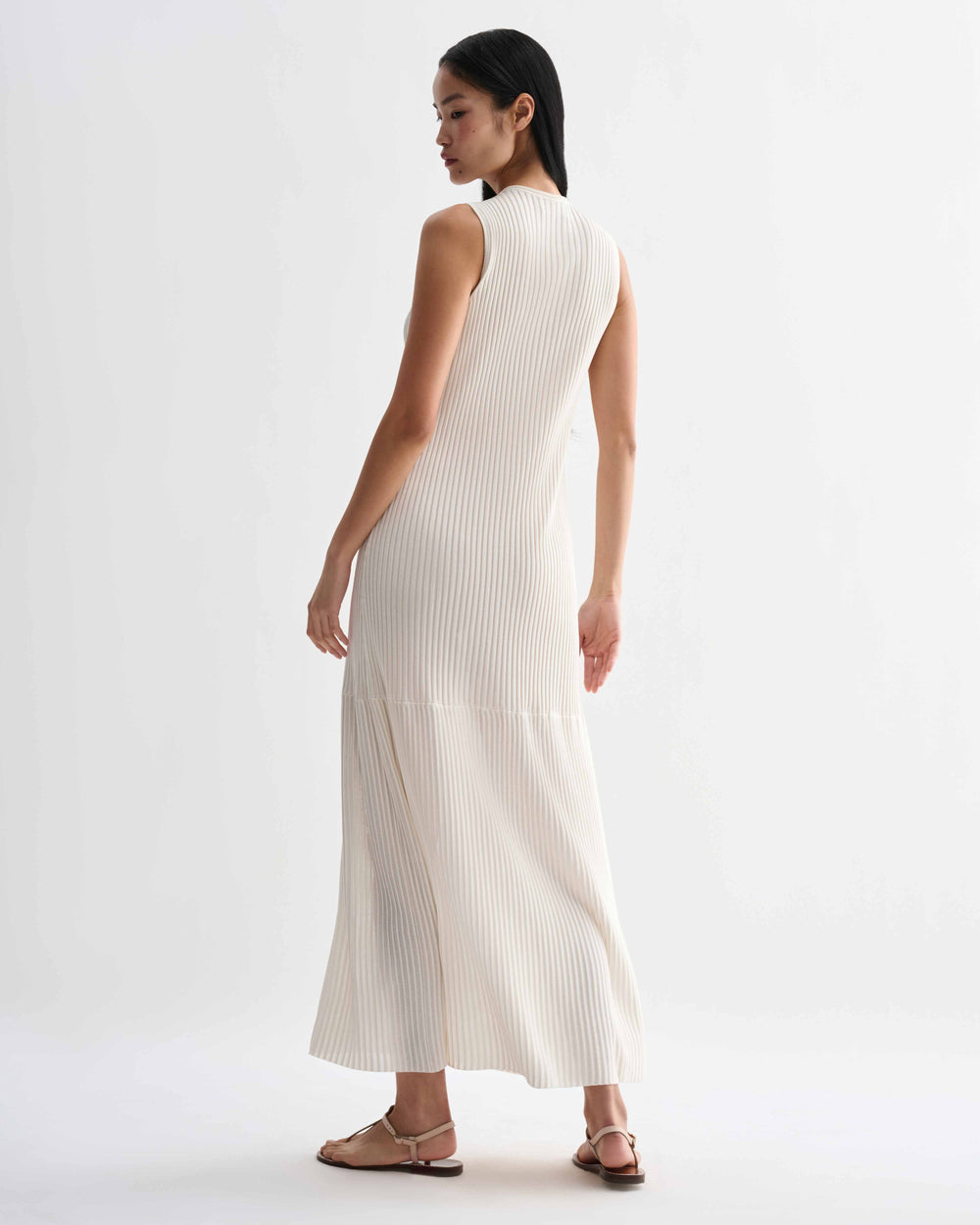 Off-white Gabby dress in viscose by Veronica De Piante, shown on a mannequin with flowing fabric and elegant design.