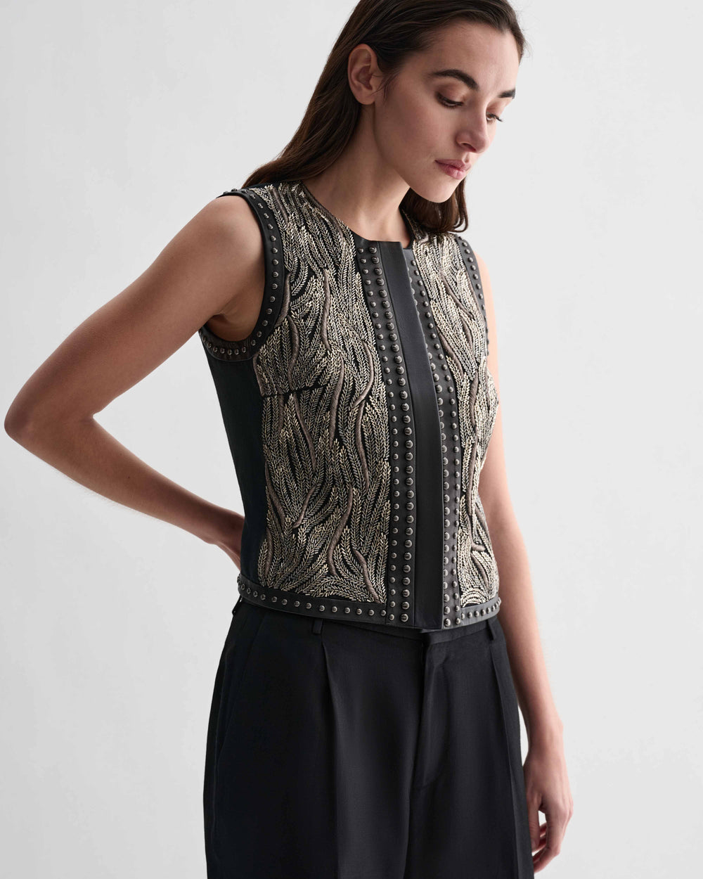 Black Ginevra Vest by Veronica De Piante, stylish sleeveless top with a fitted silhouette and subtle texture.