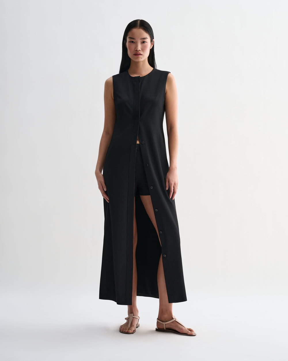 Black silk Hana dress by Veronica De Piante, featuring elegant fabric and stylish design, displayed on a mannequin.