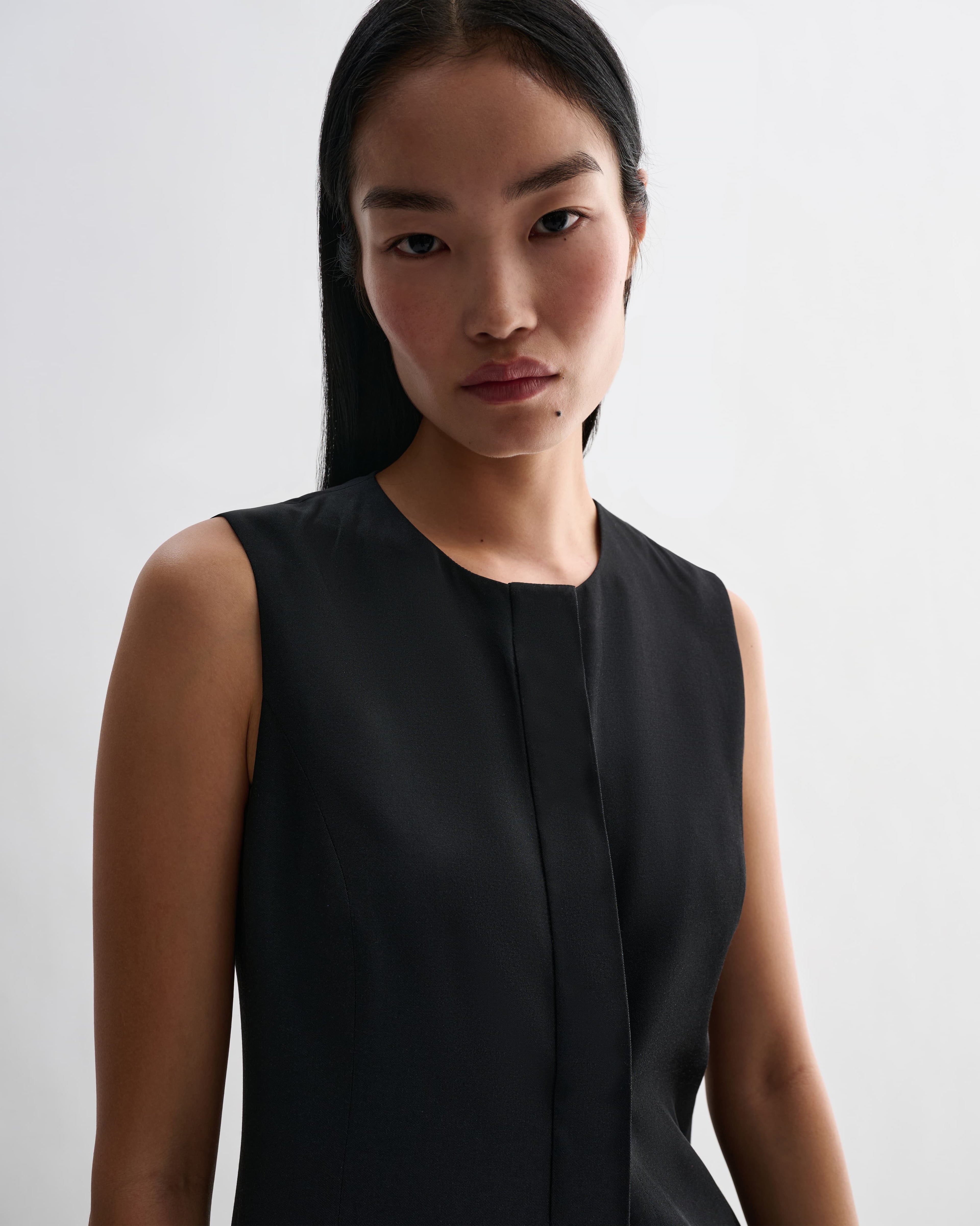 Black silk Hana dress by Veronica De Piante, featuring elegant draping and a flowing silhouette.