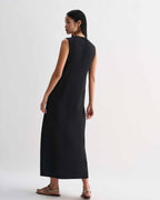 Black silk Hana dress by Veronica De Piante, showcasing elegant draping and a sleek, sophisticated design.