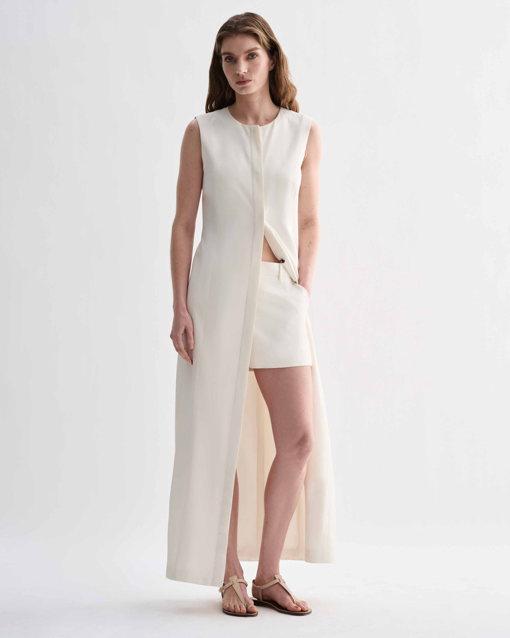 Off-white silk Hana dress by Veronica De Piante, flowing design with elegant neckline and smooth fabric details.