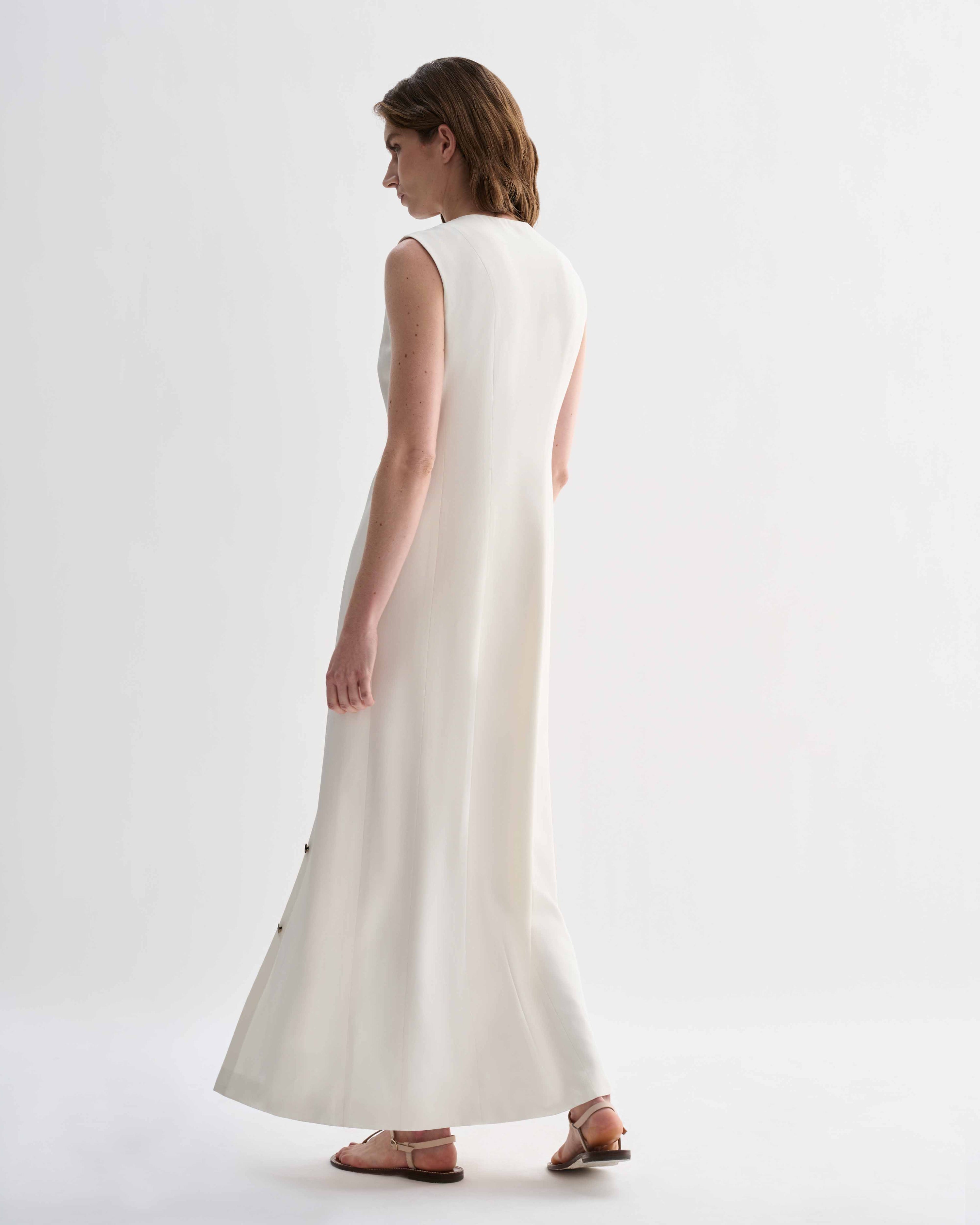 Off-white Hana Silk Dress by Veronica De Piante, featuring elegant flowing fabric and a sophisticated design.