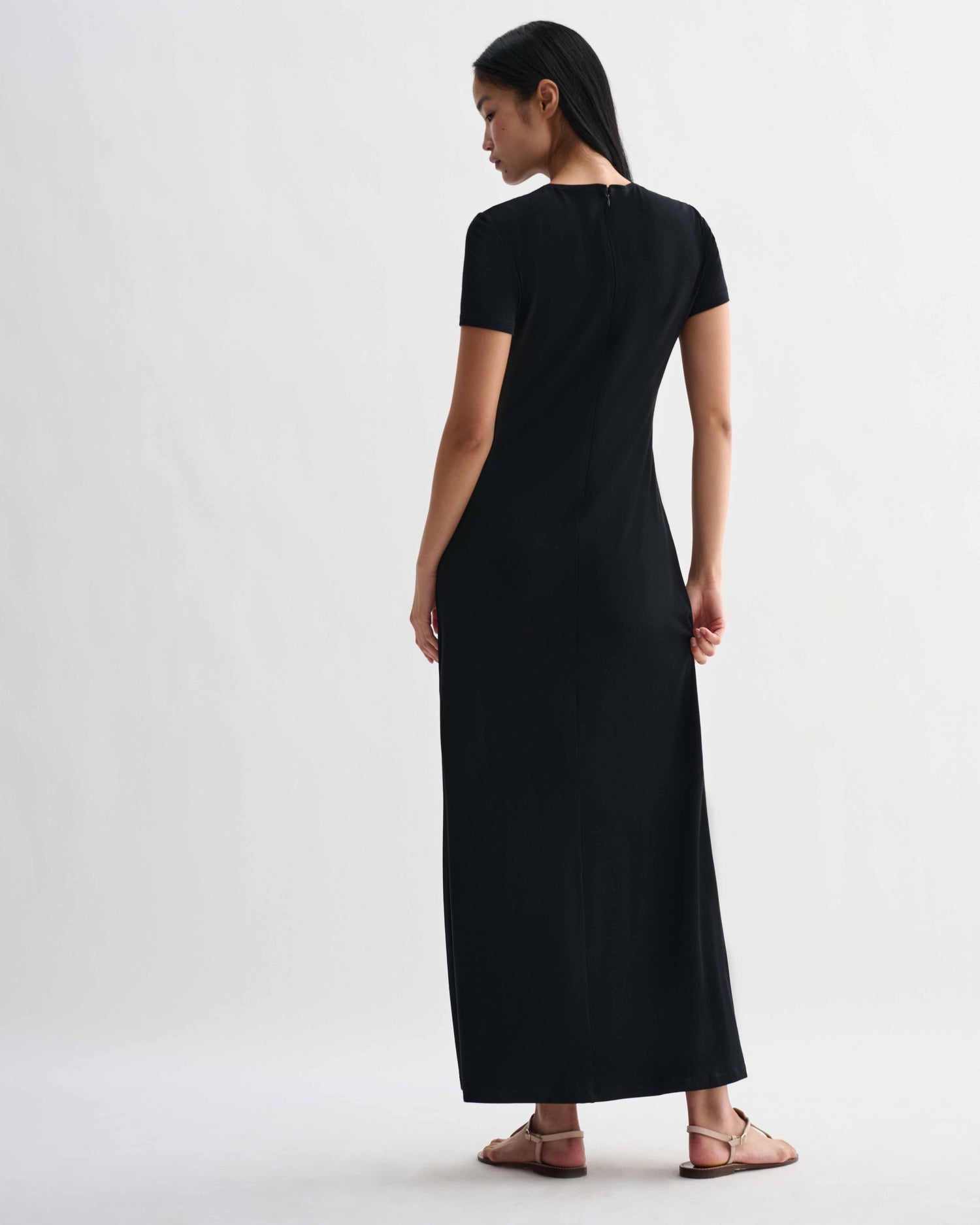 Black Veronica De Piante Harper dress in stretch viscose jersey, showcasing its fitted silhouette on a model.