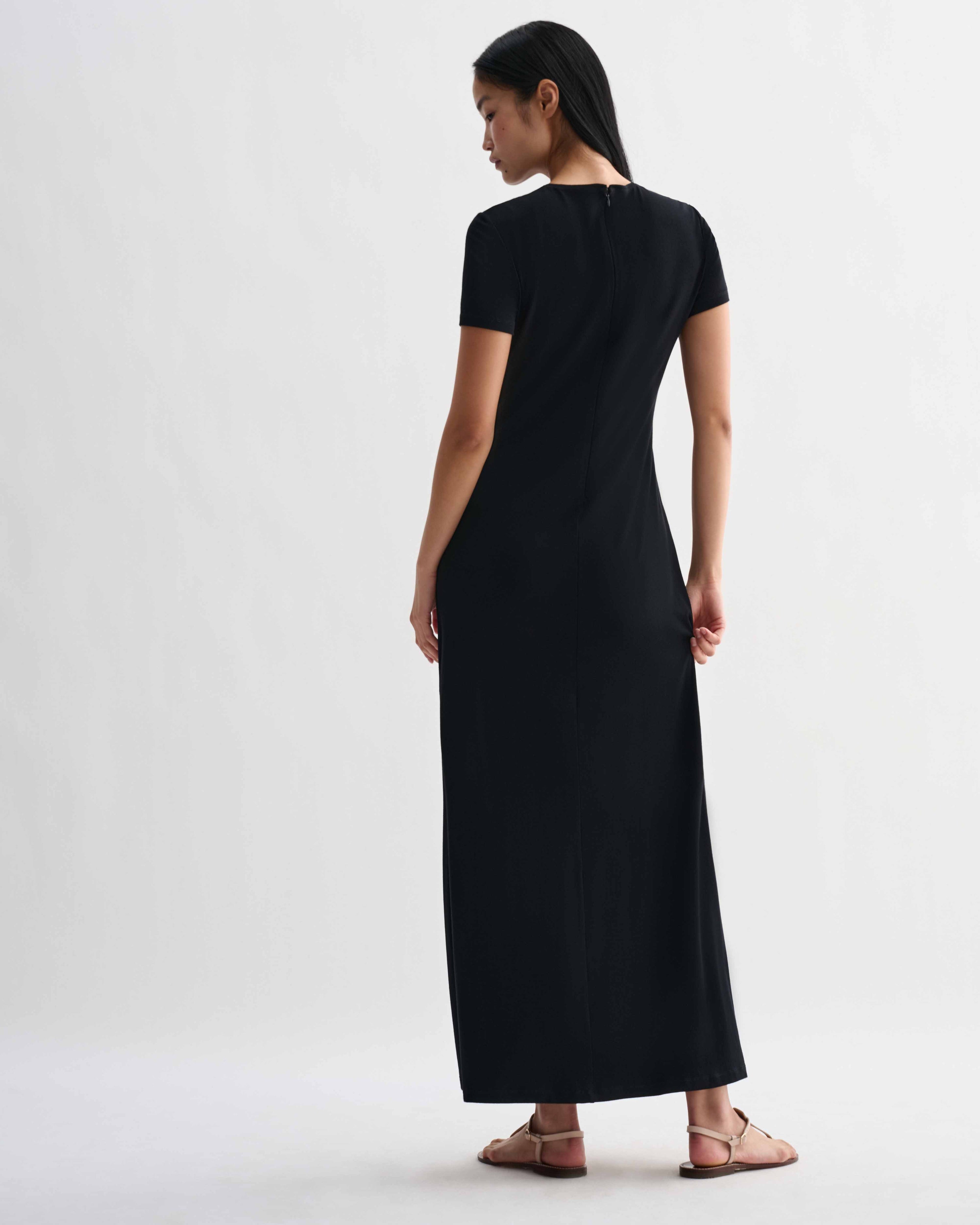 Black Veronica De Piante Harper dress in stretch viscose jersey, showcasing its fitted silhouette on a model.