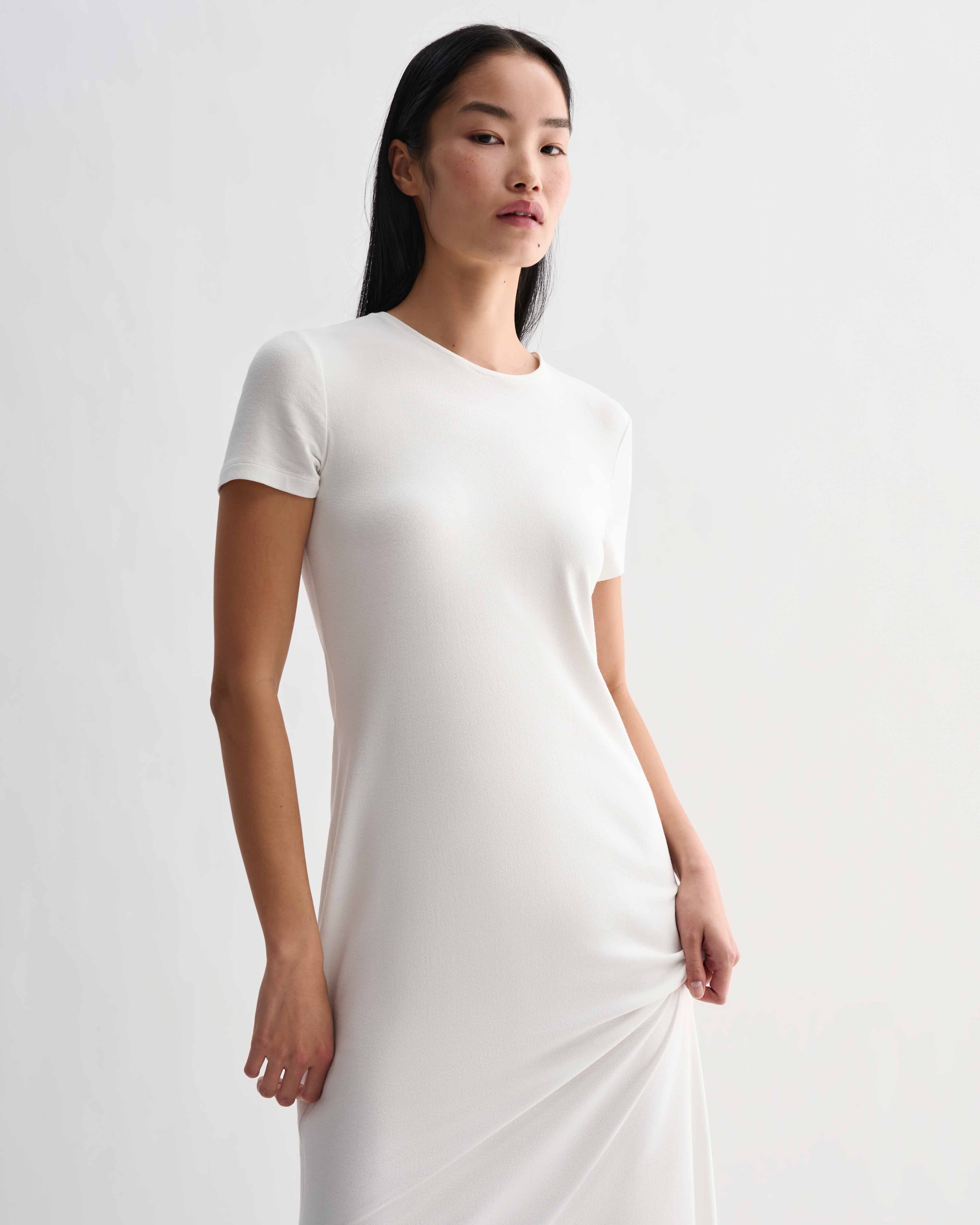 Off-white Harper dress by Veronica De Piante in stretch viscose jersey, showcasing a fitted, elegant design.