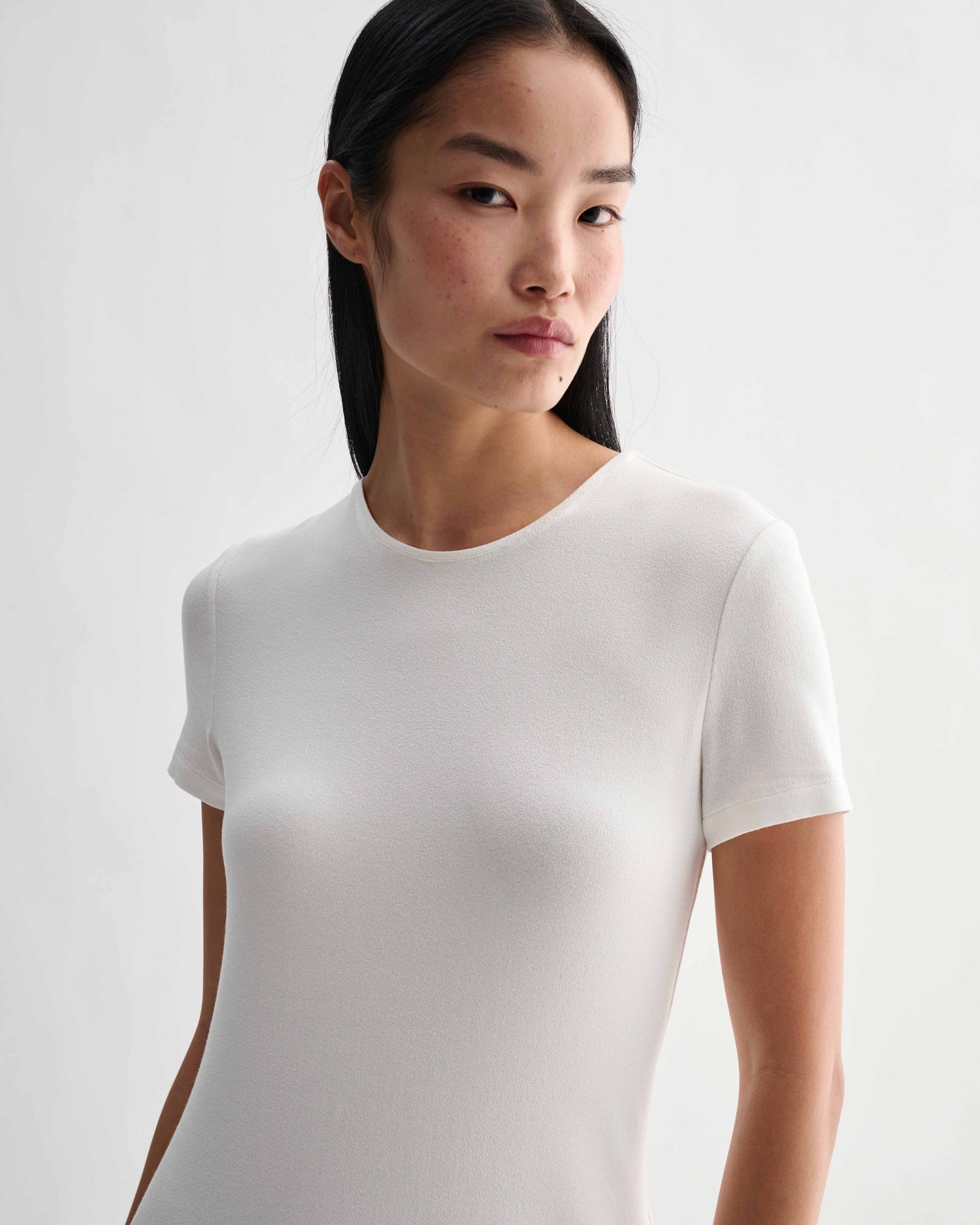 Off-white Harper dress by Veronica De Piante in stretch viscose jersey, featuring a sleek, fitted design with subtle details.