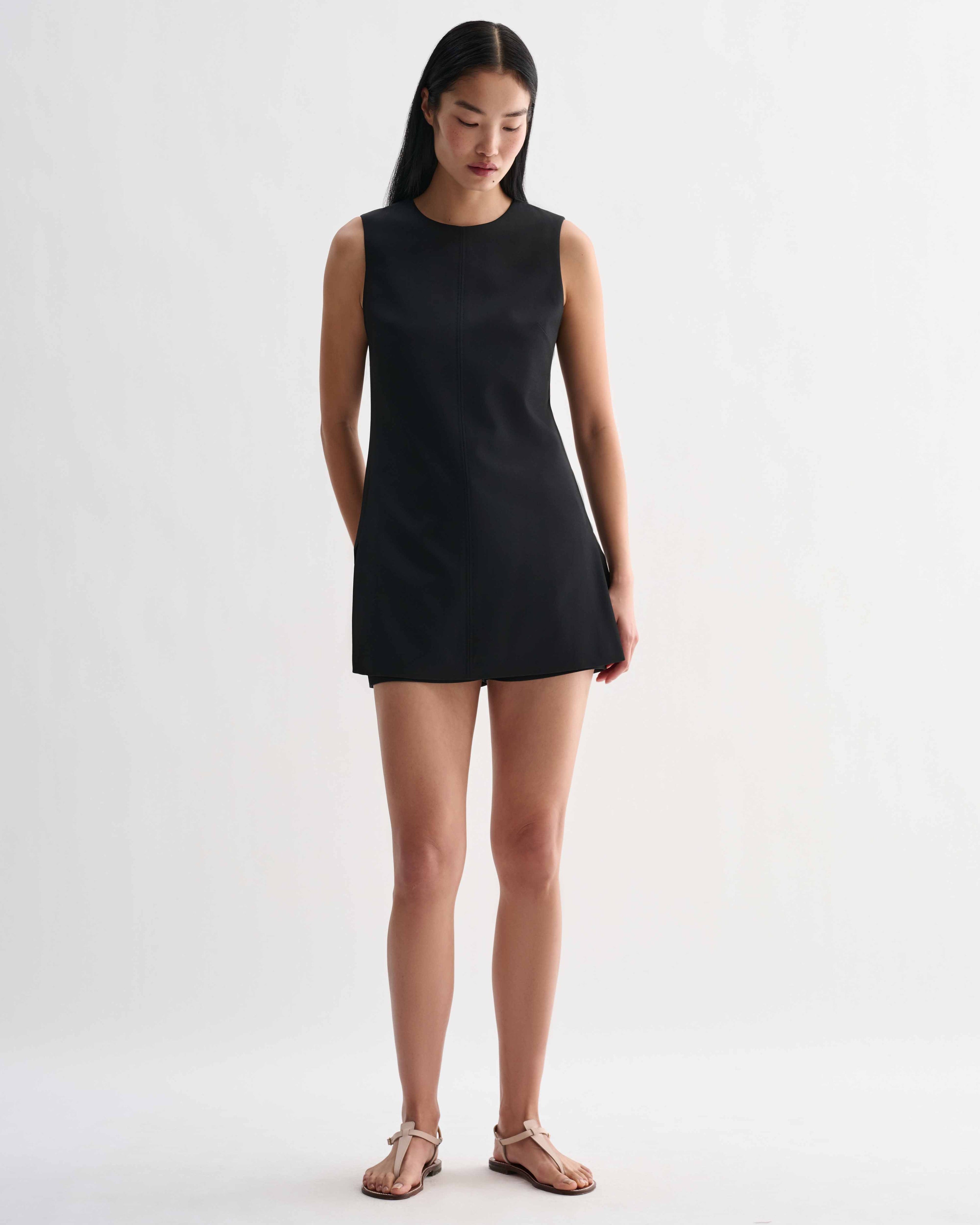 Black silk Honor tunic top by Veronica De Piante, featuring a relaxed fit and elegant drape, displayed on a neutral background.