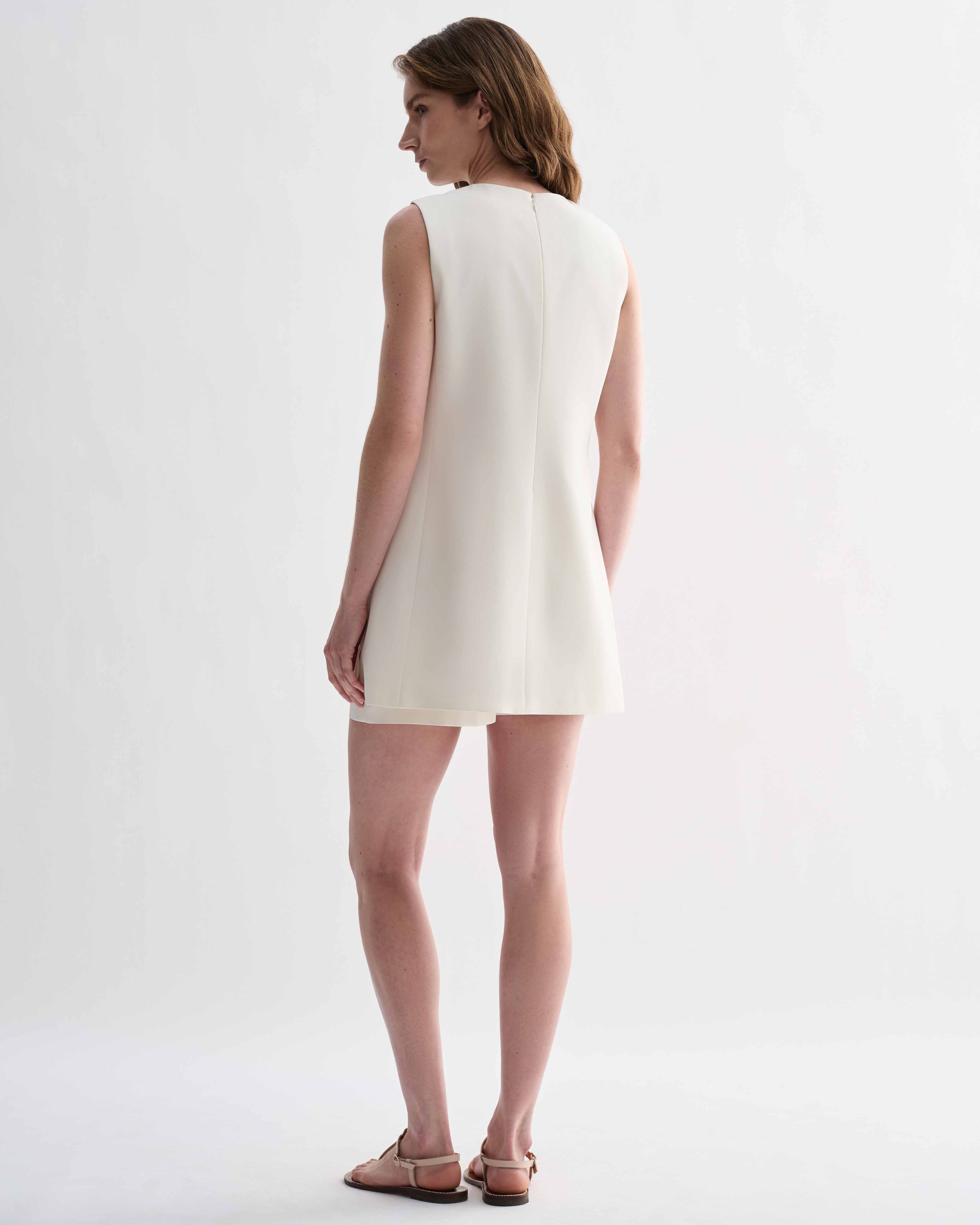 Off-white silk Honor tunic by Veronica De Piante, featuring a flowing design and elegant neckline, displayed on a mannequin.