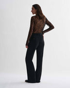 Black lace Isabel top by Veronica De Piante, shown on a model with intricate lace details and a stylish, fitted design.