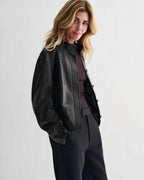 Black Juno Leather Jacket by Veronica De Piante, made from smooth nappa leather, shown on a hanger with a sleek, modern design.