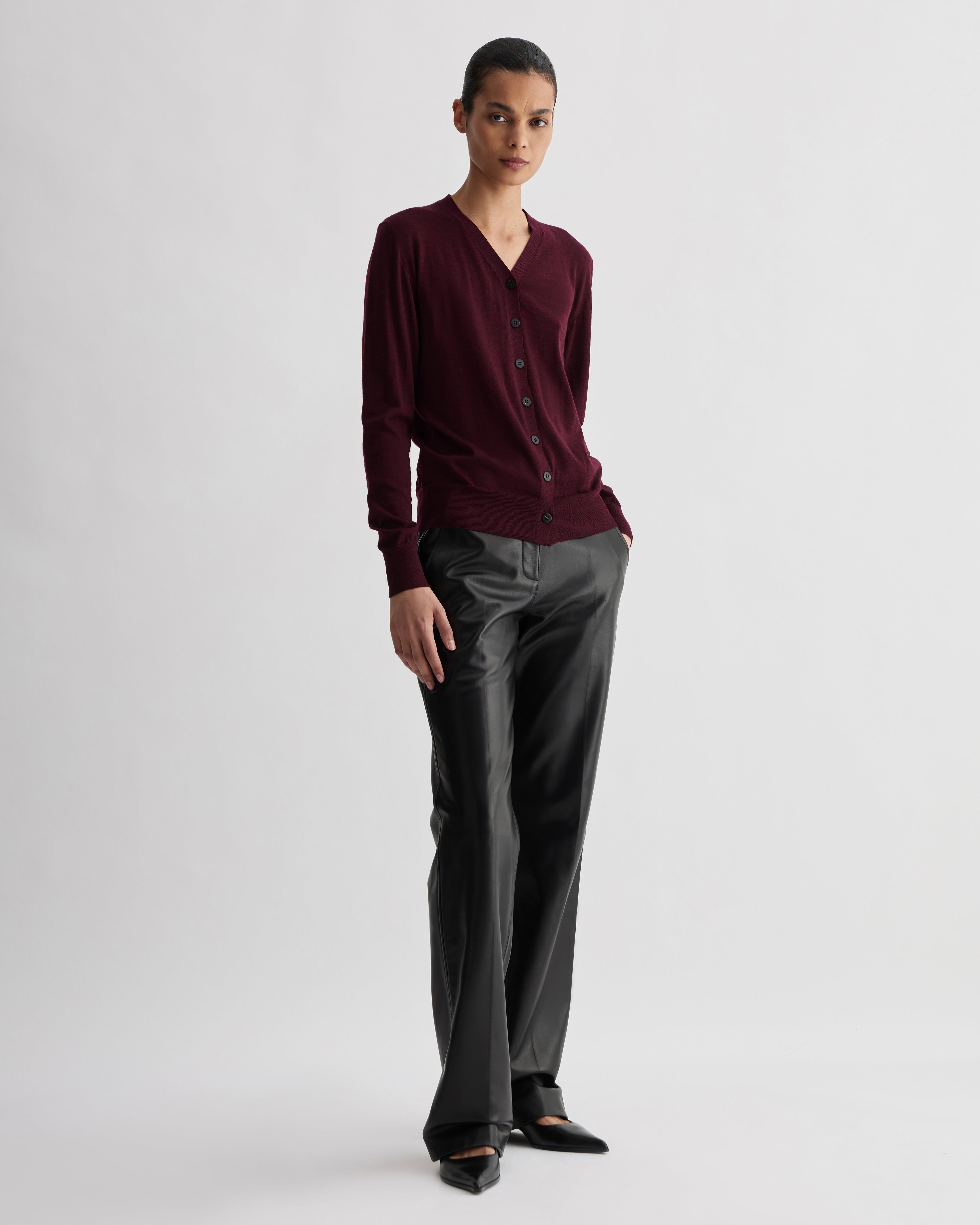 Katie Merino Wool Cardigan in Garnet, stylish knitwear with a cozy, textured appearance, featuring a classic button-front design.