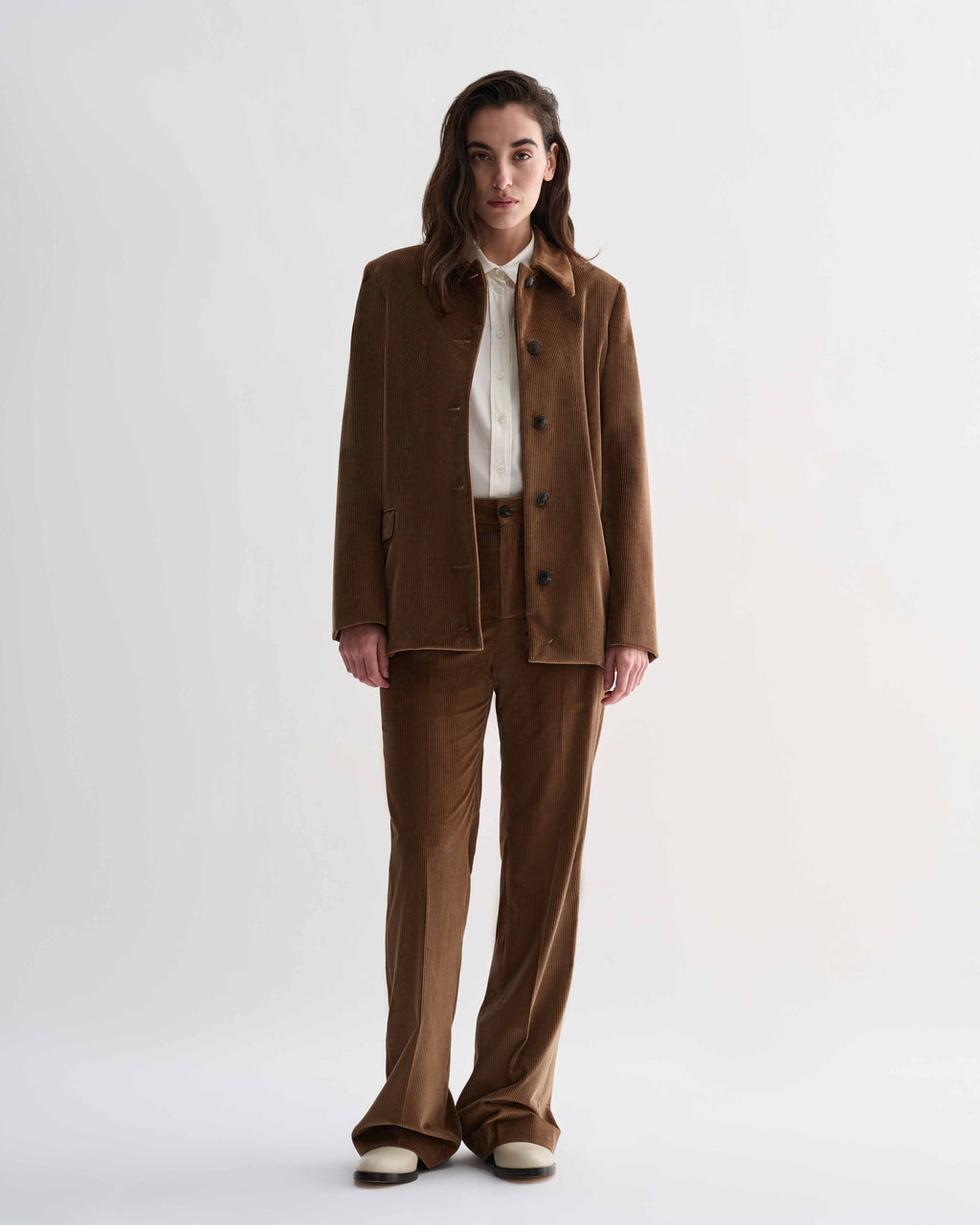 Model wearing a Veronica de Piante Klara jacket in camel thick-wale corduroy, paired with matching Taylor trousers