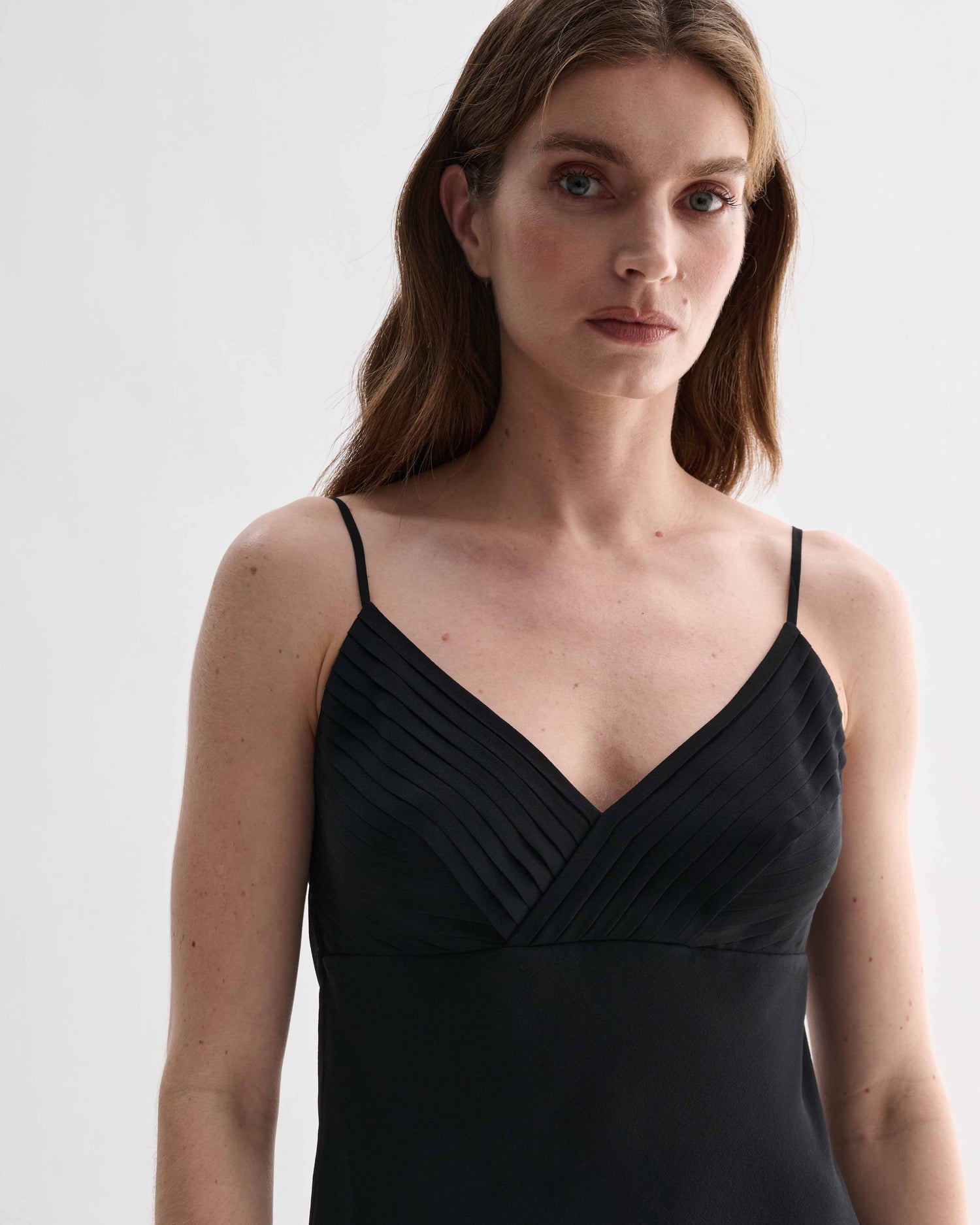 Black Lina camisole in georgette fabric by Veronica De Piante, featuring a stylish, flowy top with delicate straps.