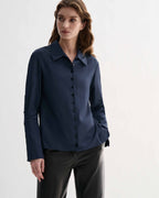 Livia Shirt in Petrol Blue silk, a women's elegant long sleeve button-front top with delicate buttons and elongated cuffs