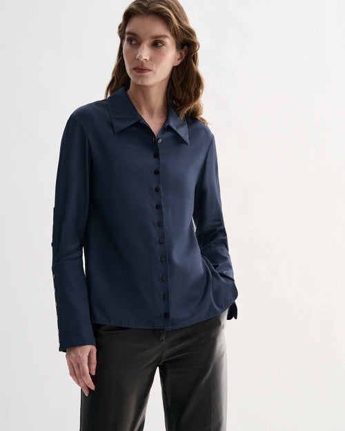 Livia Shirt in Petrol Blue silk, a women's elegant long sleeve button-front top with delicate buttons and elongated cuffs