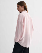 Pink silk Maren shirt by Veronica De Piante, featuring a smooth, elegant top with a classic collar and long sleeves.