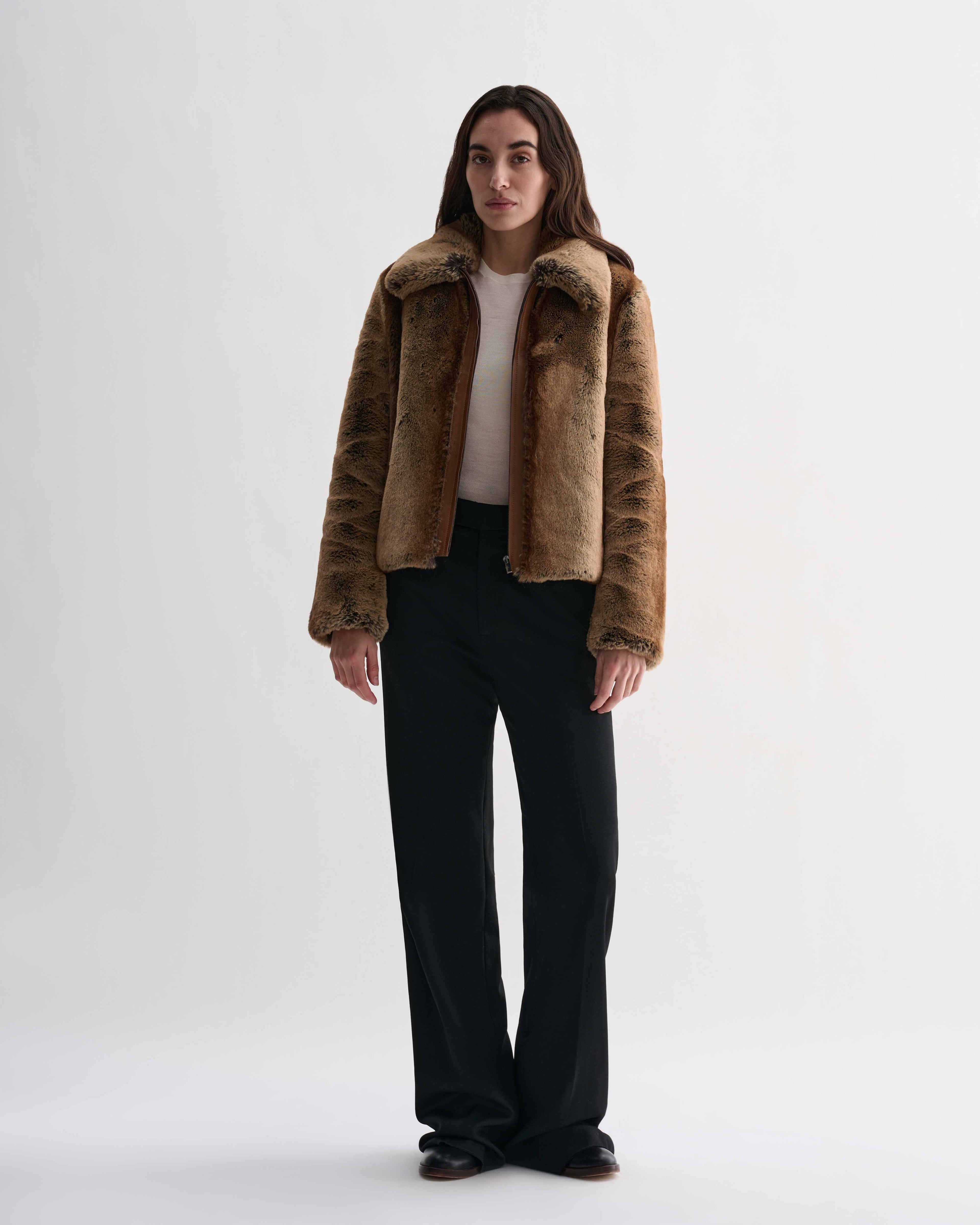 Mireia camel faux fur cropped jacket with nappa leather trim, zip front, on model