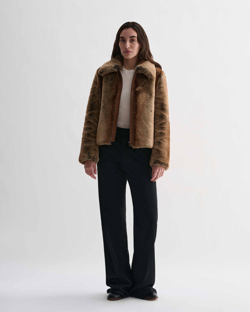 Mireia camel faux fur cropped jacket with nappa leather trim, zip front, on model