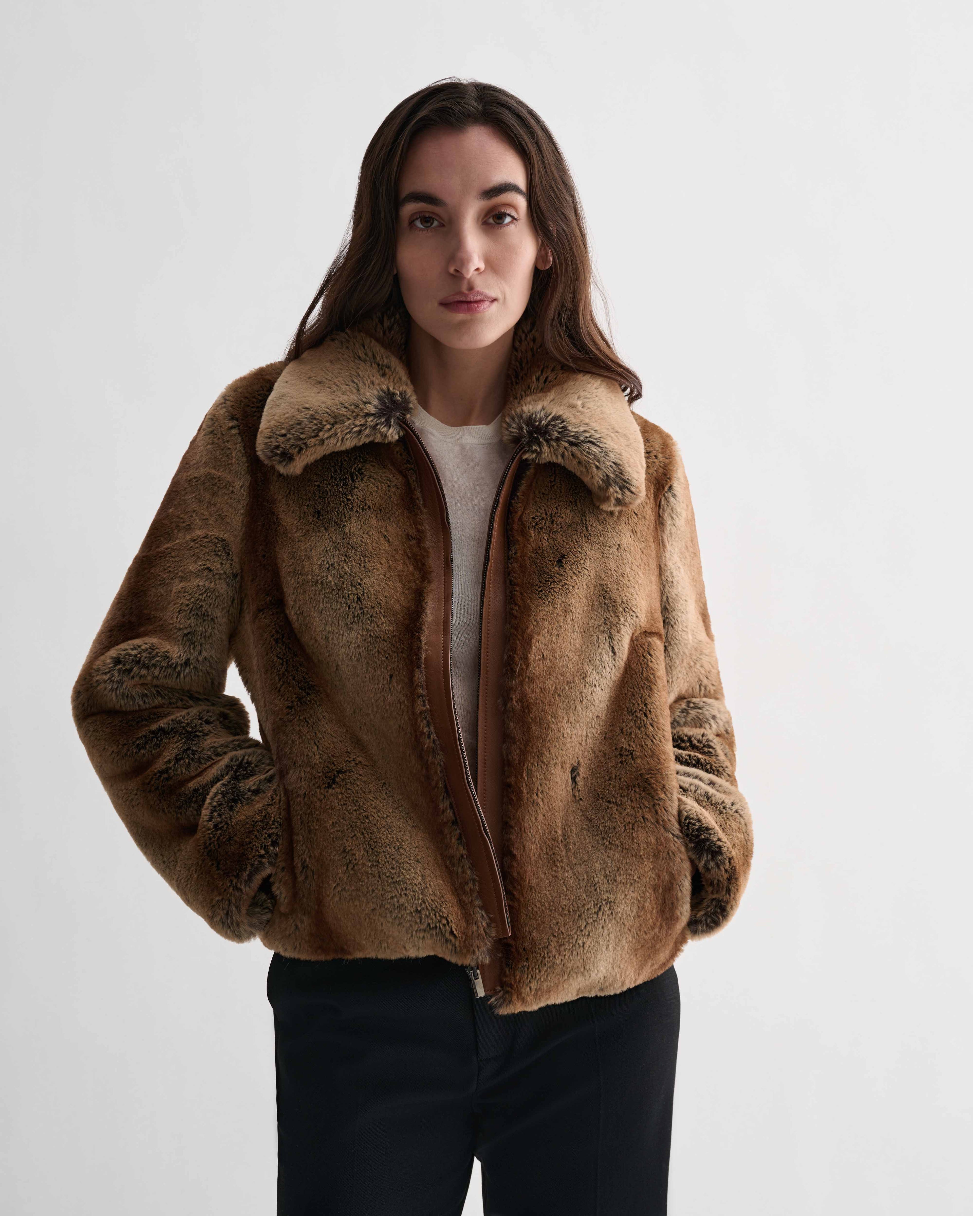 Mireia camel faux fur cropped jacket with nappa leather trim zipper, worn by model. Women's luxury winter coat