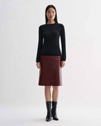 Noelia Skirt in dark red embossed leather with semi-gloss snakeskin texture, a fitted pencil skirt on model