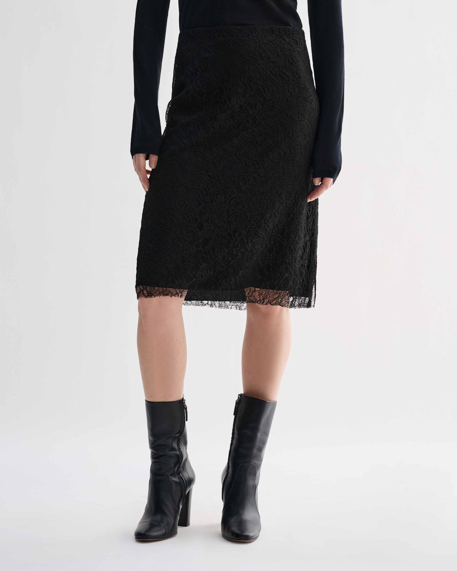 Black lace Nola skirt by Veronica De Piante, featuring intricate floral lace design and a fitted silhouette.