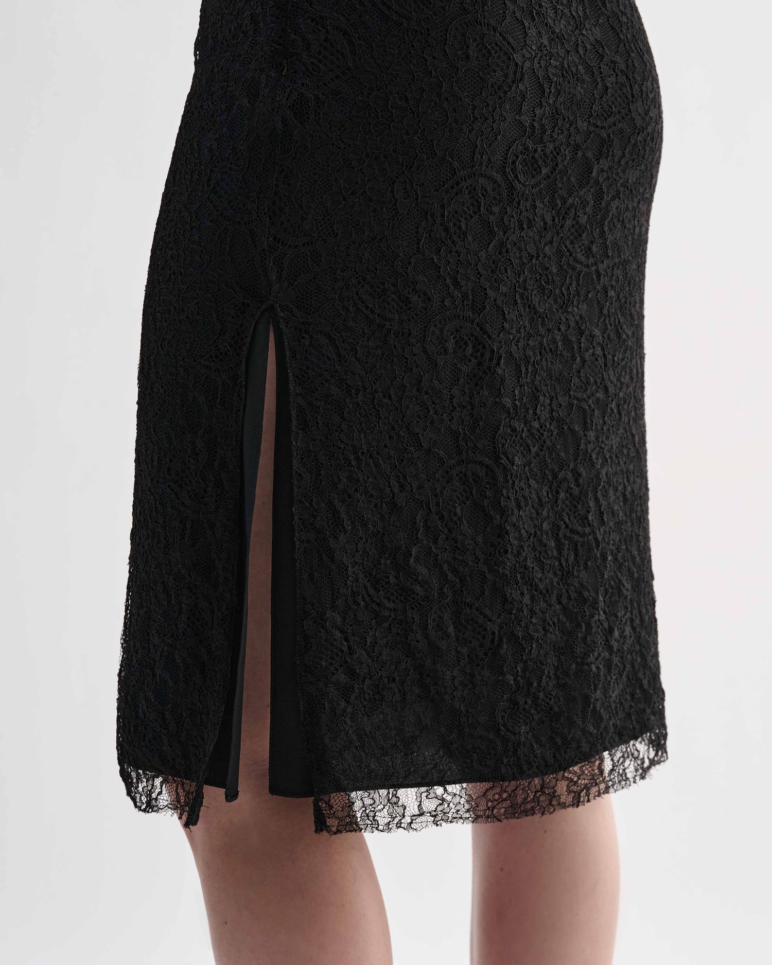 Black lace Nola skirt by Veronica De Piante featuring intricate lace details and a flowing silhouette.