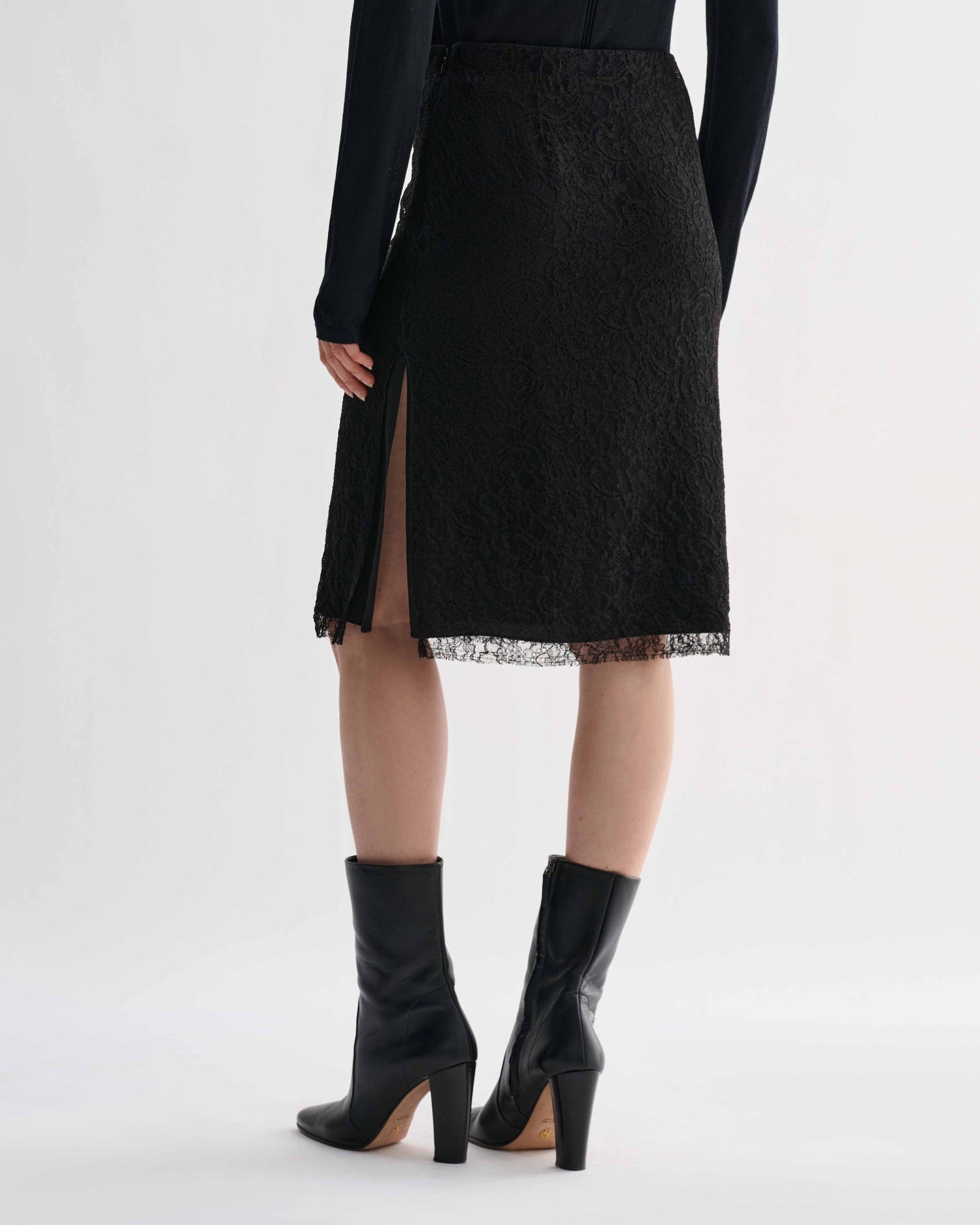 Black lace Nola skirt by Veronica De Piante featuring intricate lace details and a fitted silhouette.