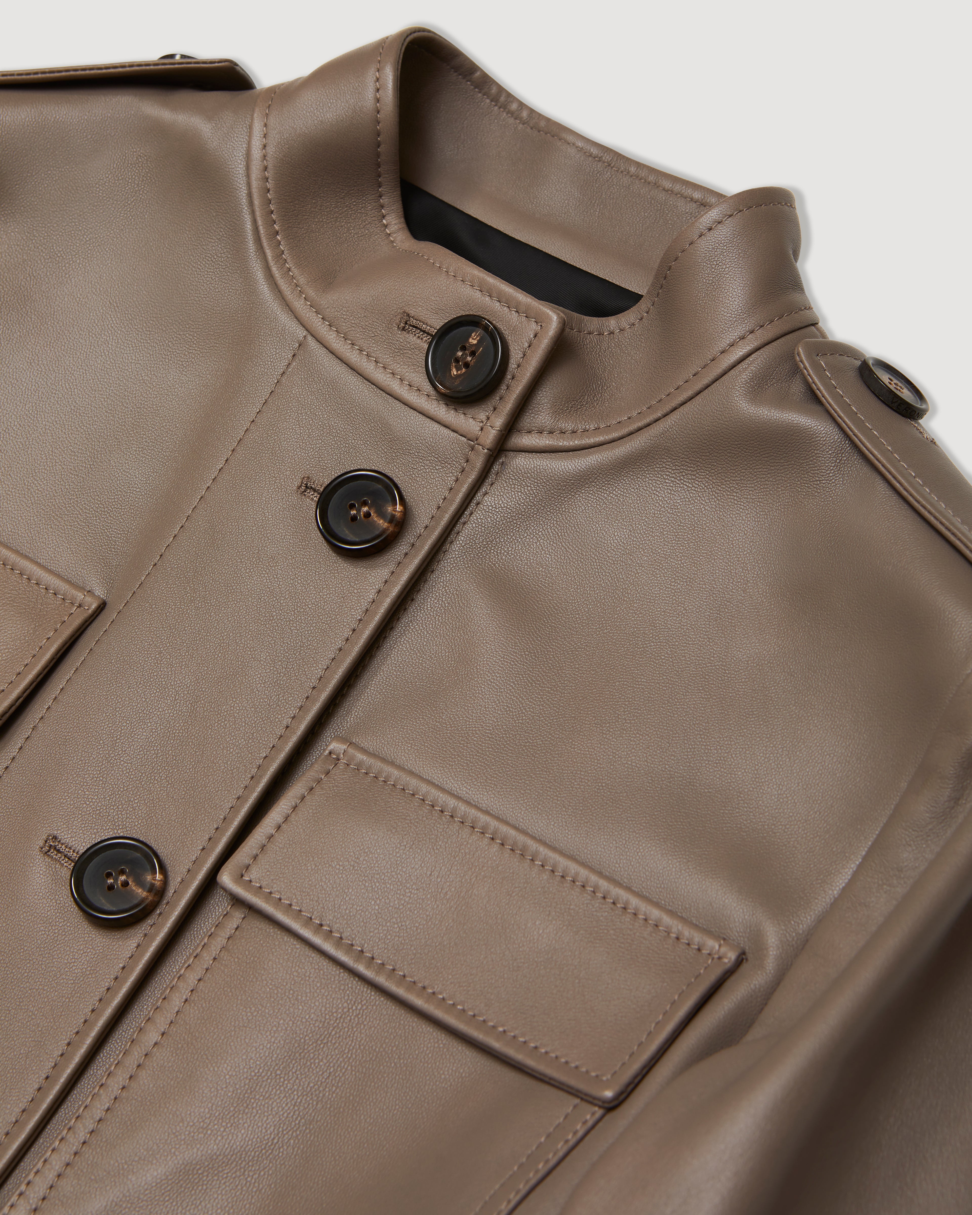 Celine smog nappa leather coat featuring a sleek design and stylish silhouette, ideal for modern outerwear.