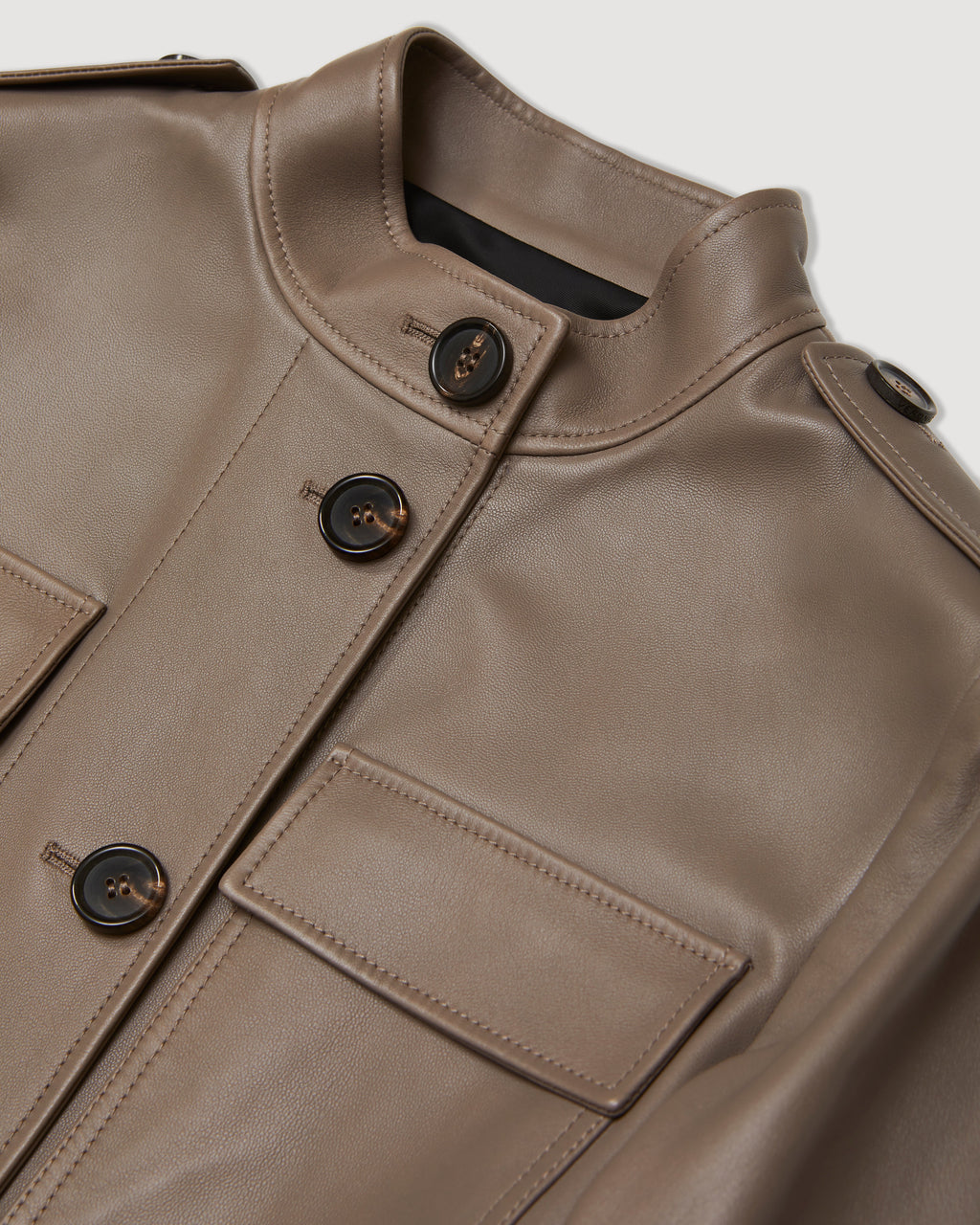 Celine Nappa Leather coat in Smog color, showcasing the sleek design and texture of the luxurious fabric.