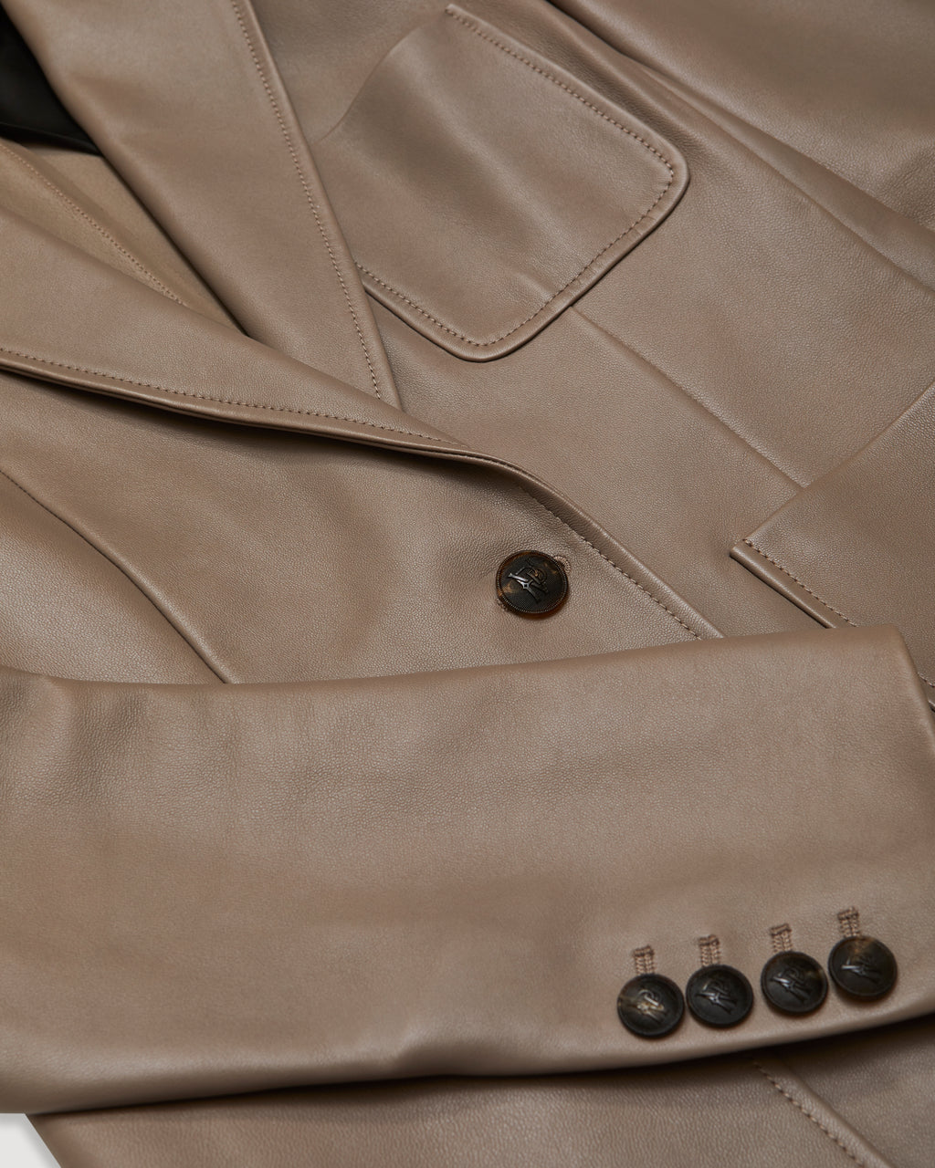 Veronica de Piante Faye leather jacket in smog gray, stylish coat with nappa leather finish, displayed on a hanger.