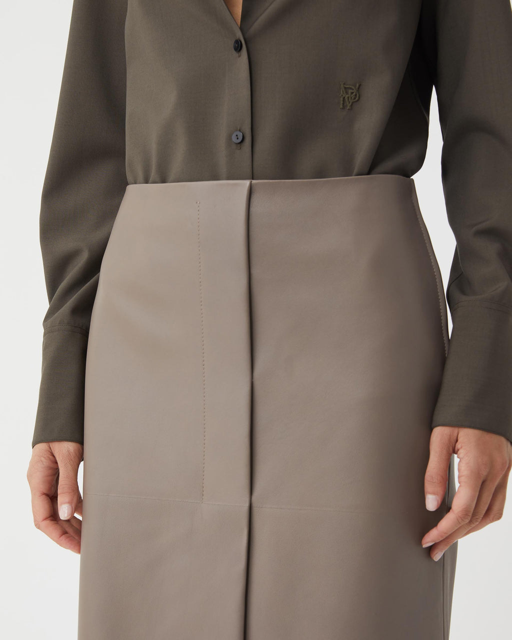 Phoebe Nappa Leather Skirt in Smog, showcasing a sleek design and soft texture, laid flat on a neutral background.