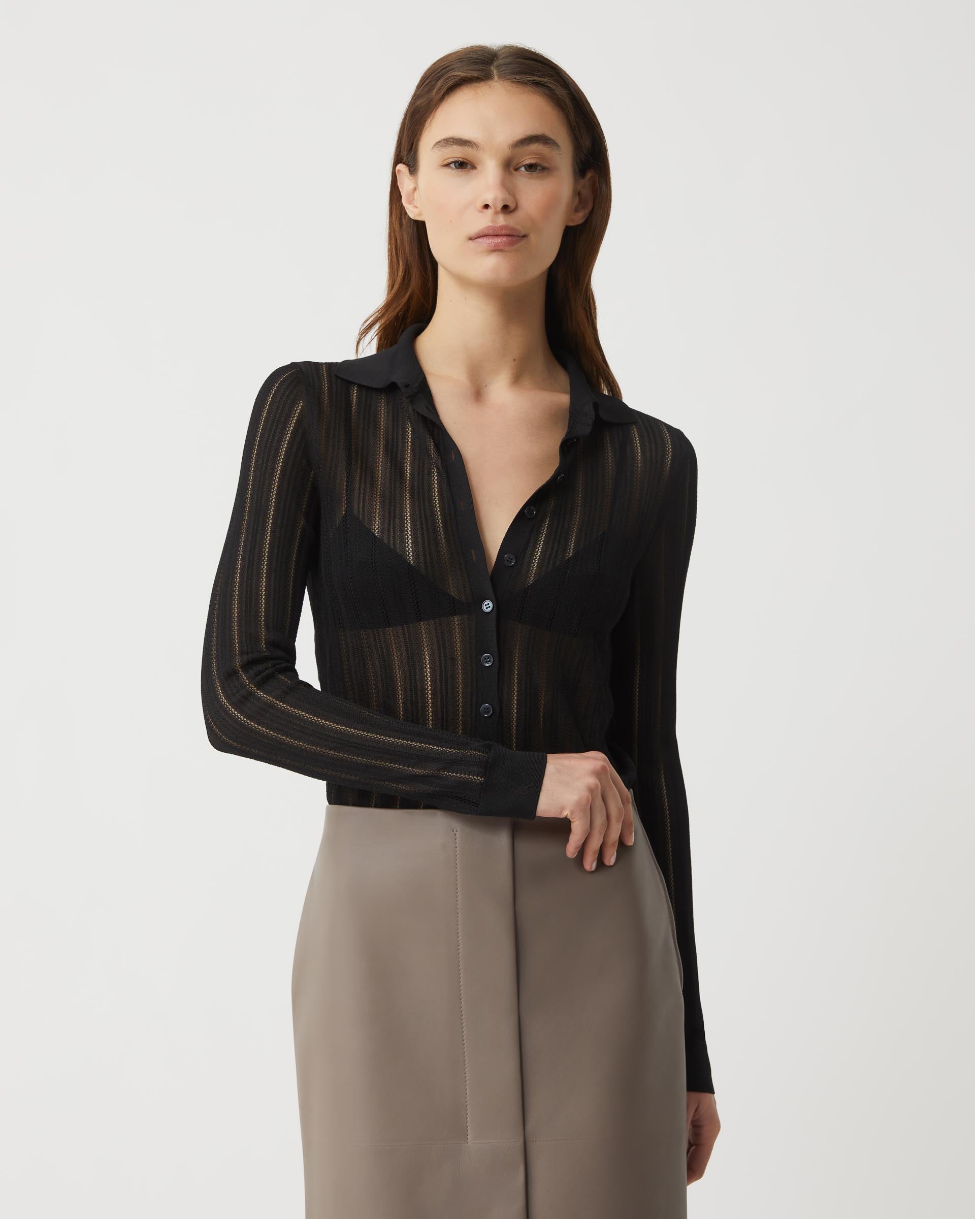 Black Lydia Silk Crepe Polo from SALE, showcasing a sleek and elegant knitwear top with a smooth silk crepe texture.