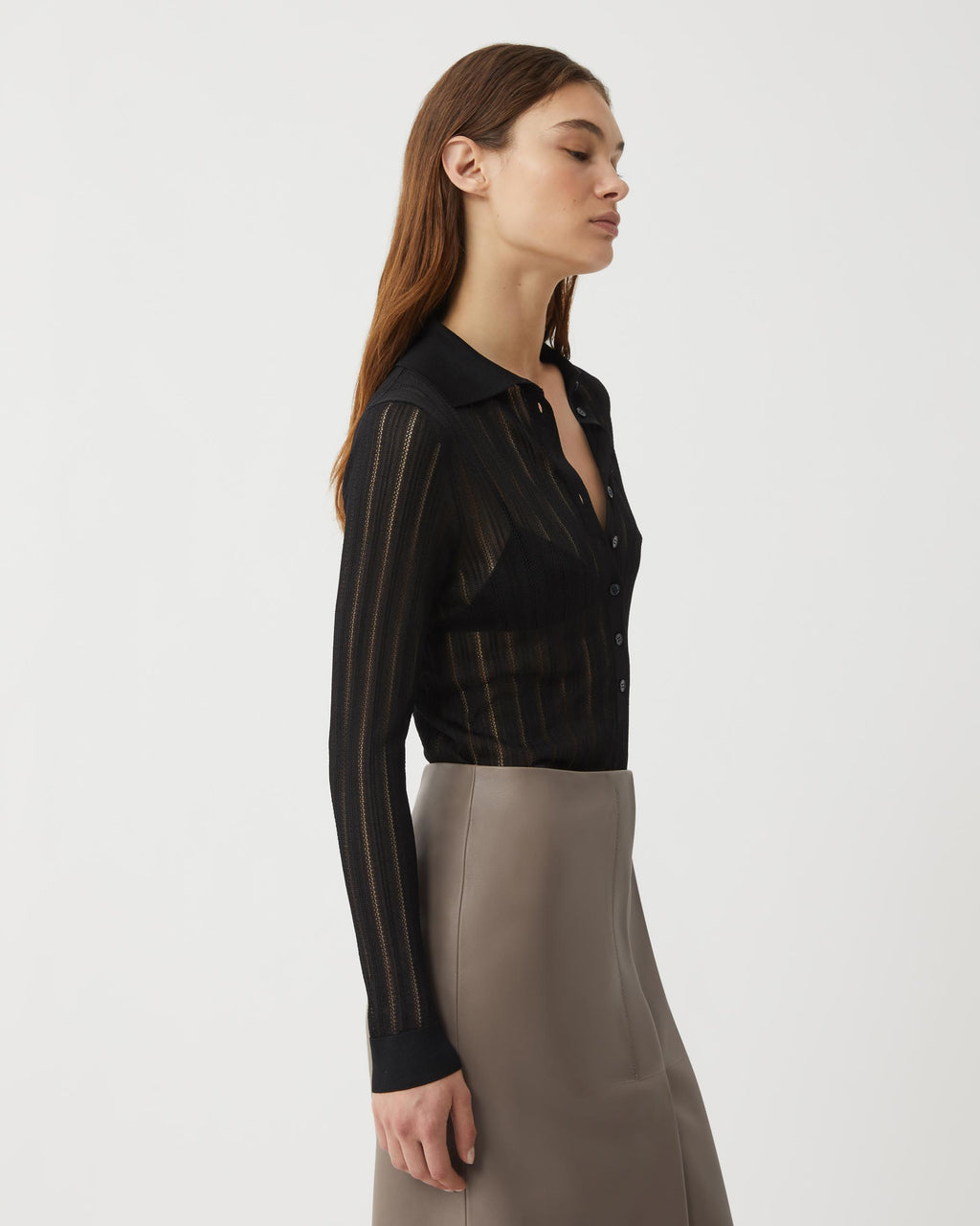 Black Lydia Silk Crepe Polo from SALE, showcasing elegant knitwear with a smooth, luxurious fabric finish.